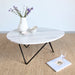 Naturel tapijt Lino gecombineerd met een salontafel in een woonkamer.ALT
